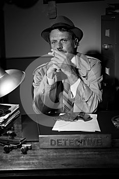 Detective smoking at desk