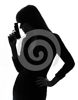 detective woman holding aiming gun silhouette