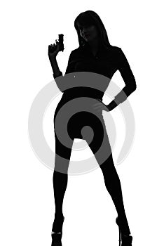 detective woman holding aiming gun silhouette