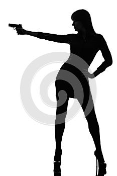 detective woman holding aiming gun silhouette