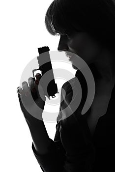 detective woman holding aiming gun silhouette