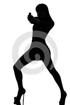 detective woman holding aiming gun silhouette