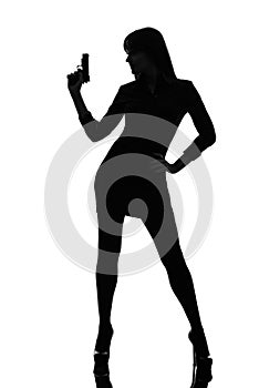 detective woman holding aiming gun silhouette