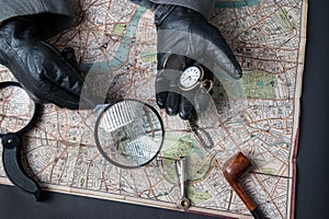 Detective at work with map