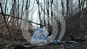 Detectives collecting evidence in a crime scene. Forensic specialists making expertise. Police officers and