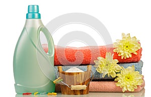 Detergent in bottle and towels photo