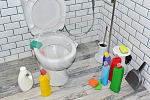 Detergent bottles and sponge for cleaning the toilet in the bathroom in home. Detergents bottles and kitchen sponges. Household