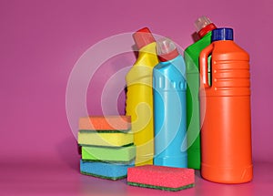Detergent bottles and sponge for washing. Detergents and laundry concept. Household chemicals for cleaning. Chemical liquid for