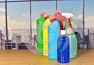 Detergent bottles on the window background. Detergents and laundry household chemicals for cleaning and washing. Housekeeping