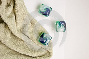 detergent pods and towel isolated on white. minimalism of detergent. laundry detergent