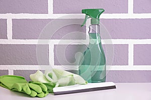 Detergent, synthetic dusters, gloves and a brush for cleaning windows