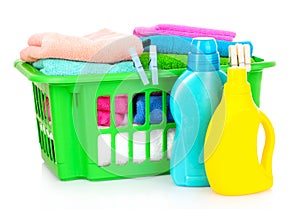Detergents and towels in basket isolated photo