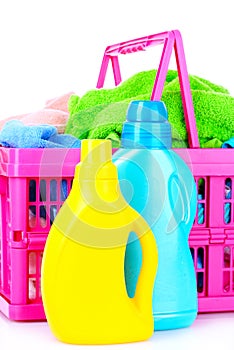 Detergents and towels in basket isolated