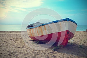 Deteriorated boat aground in the beach