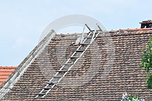 Deteriorated roof with ladder