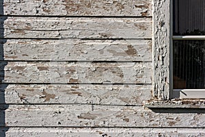 Deteriorating 19th century barn wall and window texture background
