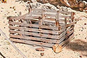 deteriorating lobster trap, on a sandy beaching