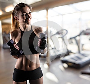 Determinated girl at the gym ready to start fitness lesson