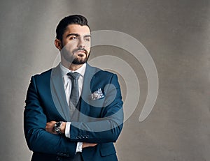 Determination defines success. Studio shot of a stylishly dressed young businessman envisioning success against a grey