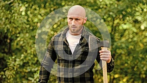 Determination of human spirit. Man checkered shirt use axe. Brutal male in forest. Power and strength. Lumberjack carry