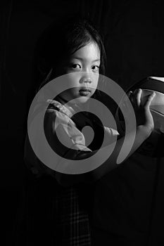 Determined Asian Child Ready for Competition in Black and White