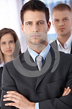 Determined businessman with coworkers photo