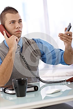 Determined businessman on phone
