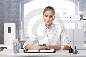 Determined businesswoman at desk