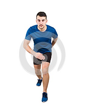 Determined caucasian man runner standing in running position looking ahead confident. Guy sprinter wearing black and blue sport