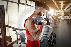 Determined male working out in gym