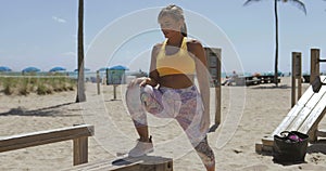 Determined sportive woman on tropical shore