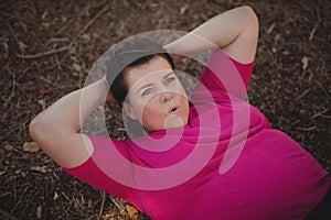 Determined woman exercising during obstacle course