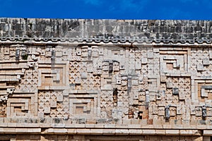 Detil of the stonework at the Palacio del Gobernador Governor`s Palace building in the ruins of the ancient Mayan city photo