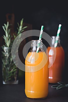 Detox citrus juices in bottle. Fresh grapefruit and orange juice in bottle