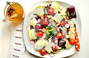 Detox diet with vegan salad and herbal tea photo