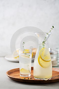 Detox drink of lemon, ginger and thyme.