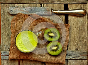 Detox food with kiwi smootie on a wooden table photo