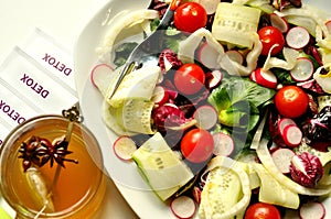 Detox food with veggie salad and herbal tea photo