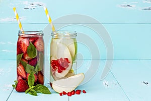 Detox fruit infused flavored water. Refreshing summer homemade cocktail. Clean eating. Copy space.