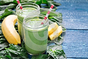 Detox green smoothie with spinach, pineapple, banana and yogurt, copy space