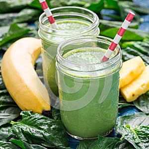 Detox green smoothie with spinach, pineapple, banana and yogurt, square