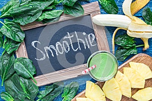Detox green smoothie with spinach, pineapple, banana and yogurt, top view