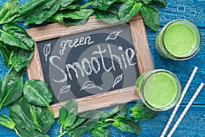Detox green smoothie with spinach, pineapple, banana and yogurt, top view