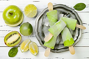 Detox, healthy green smoothie popsicles.