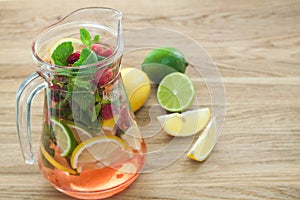 Detox water with raspberries, lime, mint for weight loss closeup