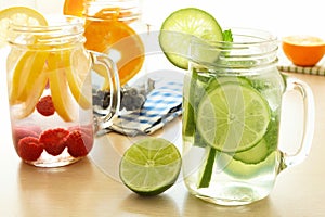 Detox water with various types of fruit in mason jars