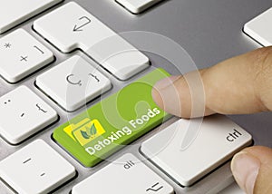 Detoxing Foods - Inscription on Green Keyboard Key photo