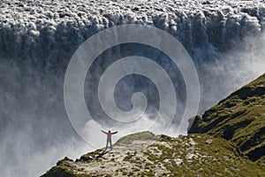 Dettifoss waterfall and person for proportionality