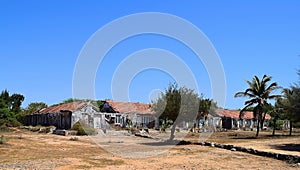 Devastation and destruction of homes and huts with Trees and Blue Sky - Natural Disaster - War