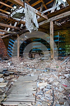 Devastation in premises of former mechanized yard of state farm in resettled village of Pogonnoye in exclusion zone of Chernobyl